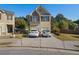 Charming two-story home with stone accents and a two-car garage, nestled in a well-maintained community at 4050 Ironwood Dr, Atlanta, GA 30349