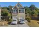 Charming two-story home with stone accents and a two-car garage, nestled in a well-maintained community at 4050 Ironwood Dr, Atlanta, GA 30349