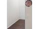Hallway featuring wood floors, neutral paint, and a dartboard for added recreation at 4050 Ironwood Dr, Atlanta, GA 30349