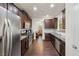 Modern kitchen with stainless steel appliances, granite countertops, dark cabinets, and hardwood floors at 4050 Ironwood Dr, Atlanta, GA 30349