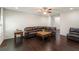 Spacious living room with a large leather sofa, dark wood floors, and ample natural light at 4050 Ironwood Dr, Atlanta, GA 30349