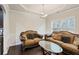 Elegant living room showcasing classic sofas, dark wood floors, and a modern chandelier at 4050 Ironwood Dr, Atlanta, GA 30349