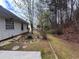 Backyard featuring a patio, fire pit area, and natural surroundings, offering a peaceful outdoor setting at 950 Spring Ives Dr, Lawrenceville, GA 30043