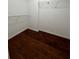 Walk-in closet with hardwood floors and metal shelving, offering ample storage space at 950 Spring Ives Dr, Lawrenceville, GA 30043