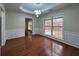 Dining room featuring decorative ceilings, wainscoting, hardwood floors and large windows at 950 Spring Ives Dr, Lawrenceville, GA 30043