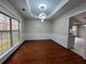 Dining room featuring decorative ceilings, wainscoting, hardwood floors and a window at 950 Spring Ives Dr, Lawrenceville, GA 30043