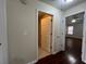 Hallway with hardwood floors and a view to other rooms at 950 Spring Ives Dr, Lawrenceville, GA 30043