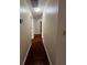 Hallway featuring hardwood floors and access to multiple rooms at 950 Spring Ives Dr, Lawrenceville, GA 30043