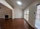 Living room featuring a fireplace, hardwood floors, and access to the backyard at 950 Spring Ives Dr, Lawrenceville, GA 30043