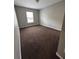 Comfortable bedroom with neutral paint, brown carpet, and natural light at 108 Creekwood Trl, Acworth, GA 30102