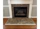 Cozy fireplace with tile surround and classic white mantel in the living room at 108 Creekwood Trl, Acworth, GA 30102