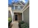 Inviting front entrance with stone accents, covered porch, and manicured shrubs at 108 Creekwood Trl, Acworth, GA 30102