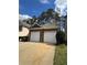 Two car garage with individual doors and new driveway at 108 Creekwood Trl, Acworth, GA 30102