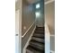 Staircase with gray steps and white trim and banister to upstairs at 108 Creekwood Trl, Acworth, GA 30102