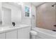 Modern bathroom with a shower-tub combination, white vanity, and stylish tile accents at 1247 Bridges Sw Ave # A, Atlanta, GA 30310