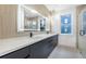 Modern bathroom features a double sink, large mirror, and a spacious shower at 1247 Bridges Sw Ave # A, Atlanta, GA 30310