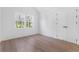 Bright, airy bedroom featuring two windows, wood flooring, and a double-door closet at 1247 Bridges Sw Ave # A, Atlanta, GA 30310