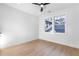 Bright room featuring wood flooring, a ceiling fan, and large windows at 1247 Bridges Sw Ave # A, Atlanta, GA 30310