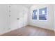 A compact room featuring wood flooring, double closets, and windows that provide ample natural light at 1247 Bridges Sw Ave # A, Atlanta, GA 30310