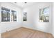 Bright bedroom with wood floors and three large windows offering views of the outdoors at 1247 Bridges Sw Ave # A, Atlanta, GA 30310