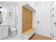 Bright entryway featuring built-in bench seating, shelving, and a full bathroom off the main hall at 1247 Bridges Sw Ave # A, Atlanta, GA 30310