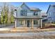 Charming two-story home features a stylish modern farmhouse elevation and a covered front porch at 1247 Bridges Sw Ave # A, Atlanta, GA 30310