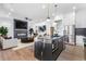 Open-concept kitchen featuring a large island, modern appliances, and seamless flow to the living room at 1247 Bridges Sw Ave # A, Atlanta, GA 30310