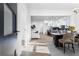 Open-concept living space with hardwood floors seamlessly connecting the living, dining, and kitchen areas at 1247 Bridges Sw Ave # A, Atlanta, GA 30310