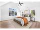 A naturally bright main bedroom with a high ceiling and large windows at 1247 Bridges Sw Ave # A, Atlanta, GA 30310