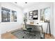 Bright and airy office space with multiple windows, a modern desk, and comfortable seating at 1247 Bridges Sw Ave # A, Atlanta, GA 30310