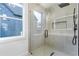 Modern shower featuring glass surround, a window, and a rain shower head at 1247 Bridges Sw Ave # A, Atlanta, GA 30310