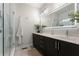Elegant bathroom featuring a double vanity, sleek cabinets, and a glass-enclosed shower at 160 Color Cir, Atlanta, GA 30317