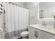 Bathroom features a shower with curtain, toilet, and vanity with a mirror at 160 Color Cir, Atlanta, GA 30317