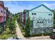 View of new colorful townhomes featuring unique exterior designs and landscaping at 160 Color Cir, Atlanta, GA 30317