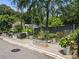 Outdoor garden beds with metal planters, lush greenery, and a dark stained fence at 160 Color Cir, Atlanta, GA 30317