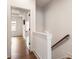 Bright hallway features hardwood floors, white trim, and access to multiple rooms in the home at 160 Color Cir, Atlanta, GA 30317