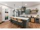 Stylish kitchen offers a spacious island with seating, modern fixtures, and views to the outdoors at 160 Color Cir, Atlanta, GA 30317