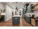 Modern kitchen featuring an island, pendant lighting, stainless appliances, and sleek cabinetry at 160 Color Cir, Atlanta, GA 30317