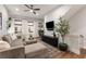 Comfortable living room featuring contemporary furniture, a ceiling fan, and ample natural light at 160 Color Cir, Atlanta, GA 30317