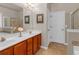 Bathroom featuring double vanity with tiled floors, shower, and tub at 3919 Teal Cir, Powder Springs, GA 30127