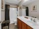 Bathroom featuring decorative curtains, a bathtub and shower combo, and tile flooring at 3919 Teal Cir, Powder Springs, GA 30127