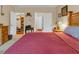 Cozy bedroom featuring neutral walls, wood furniture, and a comfortable red bedspread at 3919 Teal Cir, Powder Springs, GA 30127