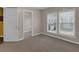 Bedroom with neutral walls, plush carpeting, and natural light streaming through windows at 3919 Teal Cir, Powder Springs, GA 30127