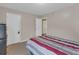 Bedroom with neutral walls and striped bedding is complemented by ample natural light at 3919 Teal Cir, Powder Springs, GA 30127
