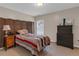 A well-appointed bedroom is complete with neutral walls and carpet, plus modern decor at 3919 Teal Cir, Powder Springs, GA 30127