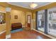 Well-lit dining room with hardwood floors, a bench, and a large window offering a welcoming space for meals at 3919 Teal Cir, Powder Springs, GA 30127