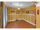 Bright dining room with hardwood floors, detailed molding, and ample natural light creating an inviting atmosphere at 3919 Teal Cir, Powder Springs, GA 30127