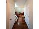 Bright entryway with hardwood floors leading to the staircase and main living area at 3919 Teal Cir, Powder Springs, GA 30127