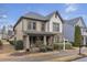 Inviting two-story home with a stone-accented porch, landscaped front yard, and manicured shrubs at 3919 Teal Cir, Powder Springs, GA 30127