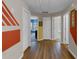 Hallway that branches off into three rooms with different paint colors at 3919 Teal Cir, Powder Springs, GA 30127
